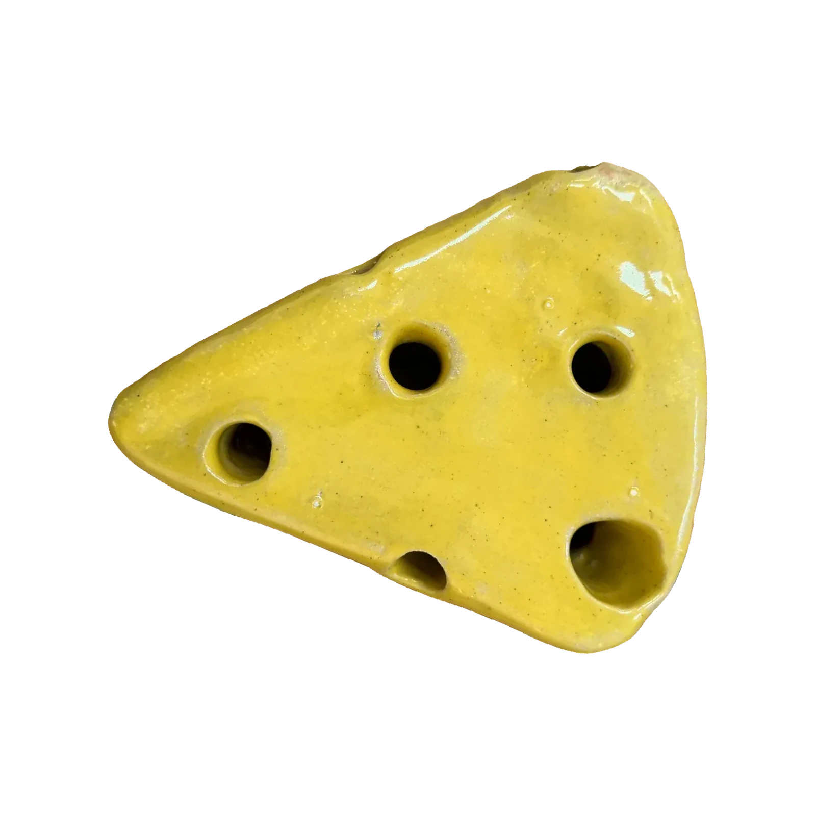 Yellow glazed ceramic wedge with holes poked through it, shaped like a wedge of Swiss cheese