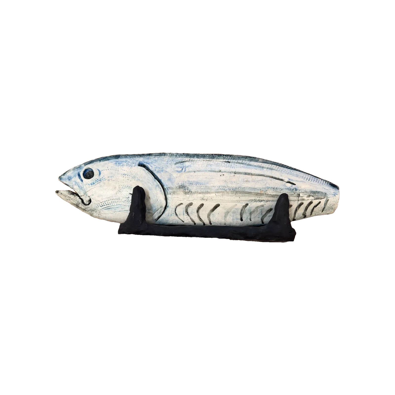 Ceramic fish sculpture, the front half intact with a blue-glazed head, the back half stripped to red and white ribs